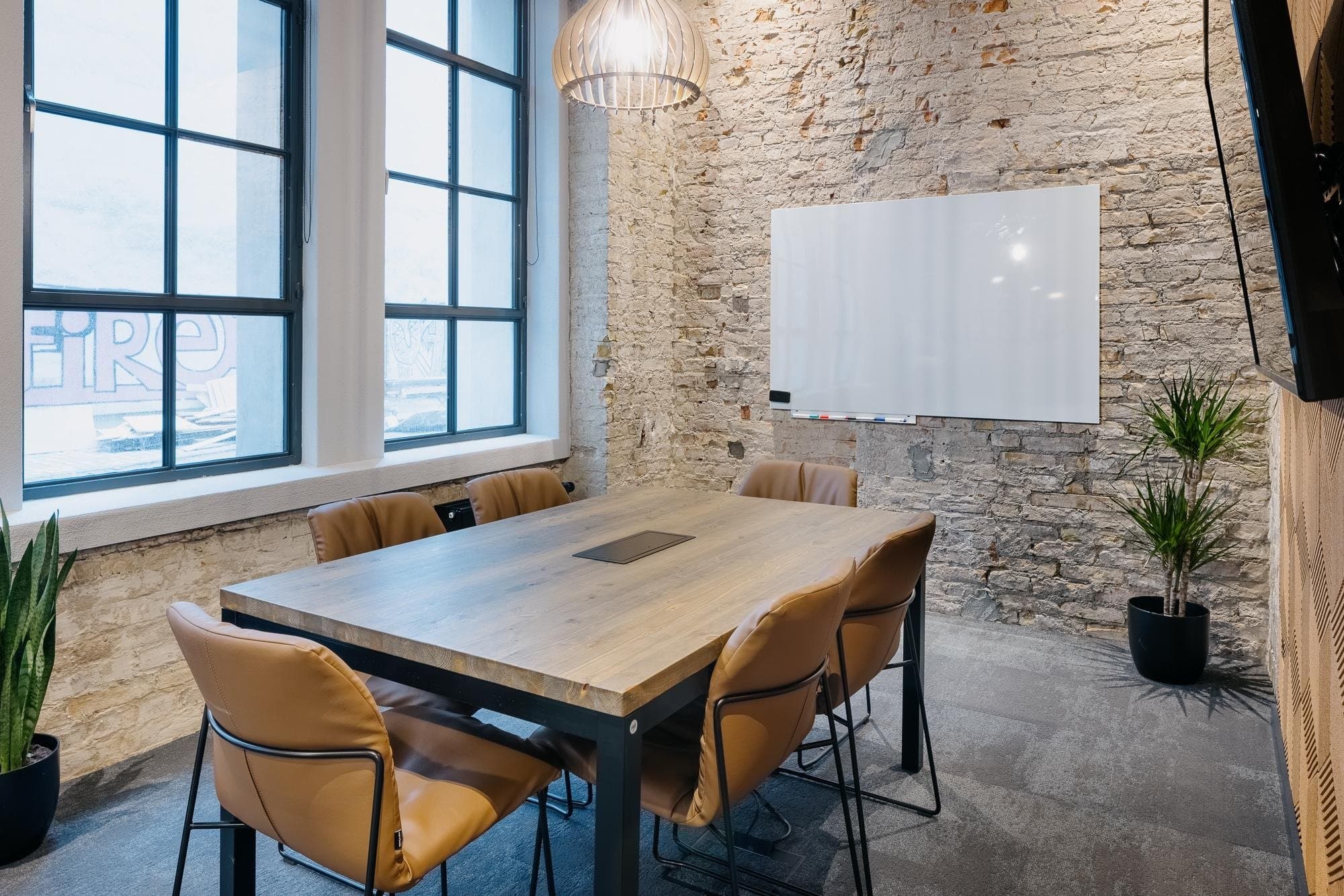 Meeting room with modern and rustic design bathed in natural light at Techspace Eiswerk