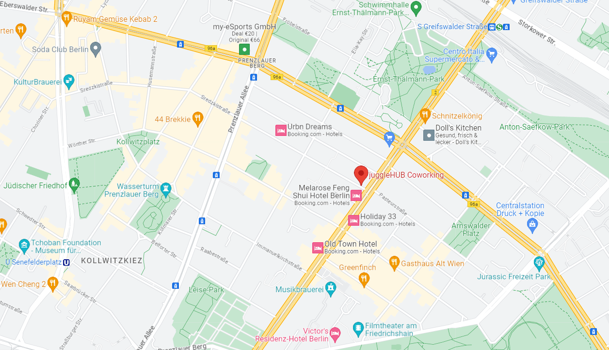 Versatile space equipped with flatscreen & unique chalkboard wall at juggleHUB interior photo 3